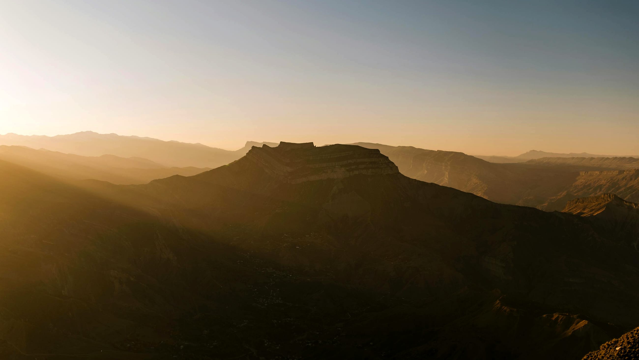 Golden-hour view over the Jebel Shams canyon